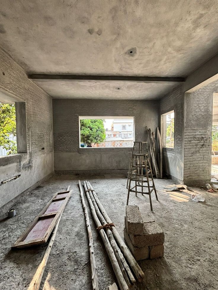 Before — the bare concrete shell of the bedroom